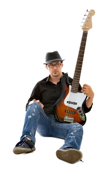 Bassist sitting on white background — Stock Photo, Image