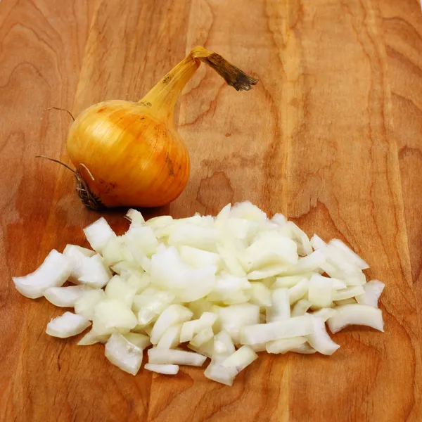 Chopped onion on board — Stock Photo, Image