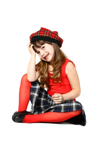 Dziewczyna siedzi na czerwono — Zdjęcie stockowe