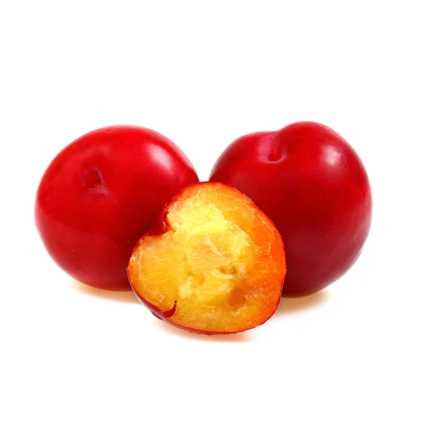 Two plums with a half — Stock Photo, Image