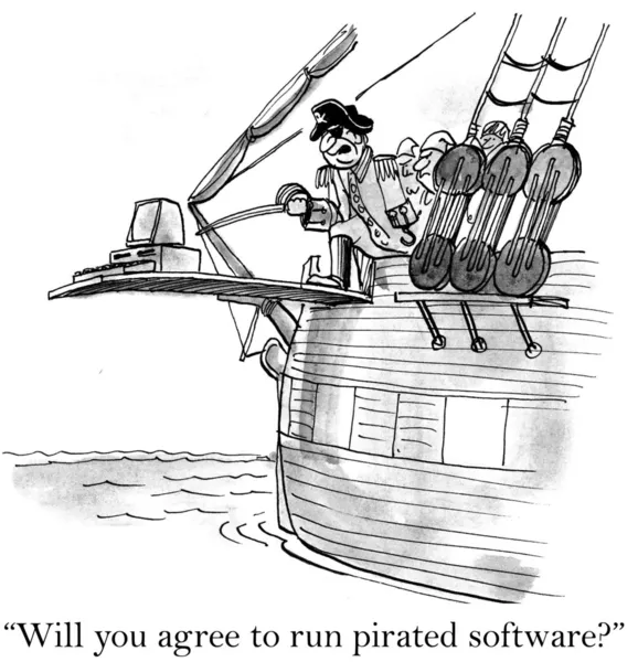 Пират угрожает компьютеру — стоковое фото