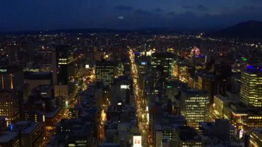 Footage on time-lapse over Sapporo city from Sapporo JR Tower Observatory T38, Japan at night time.