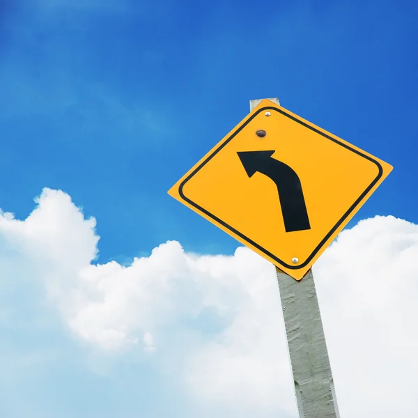 Turn left sign on blue sky — Stock Photo, Image