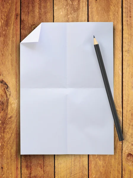 Blank crumpled white paper with pencil on vintage wood wall — Stock Photo, Image