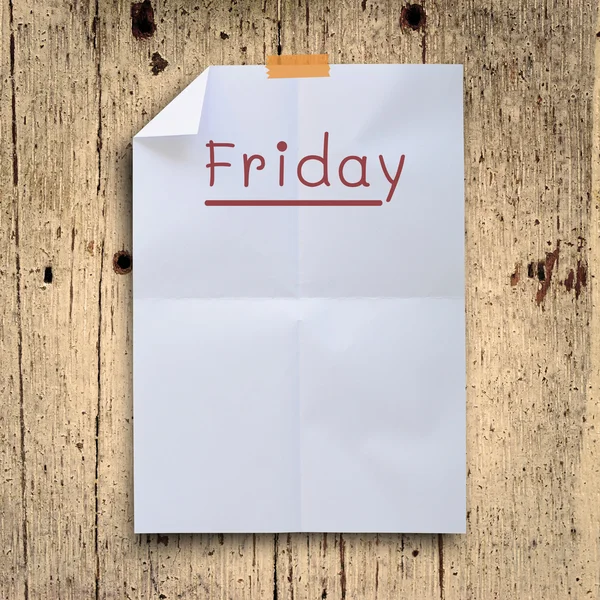 Friday planning on white fold paper with grunge retro wall panel — Stock Photo, Image