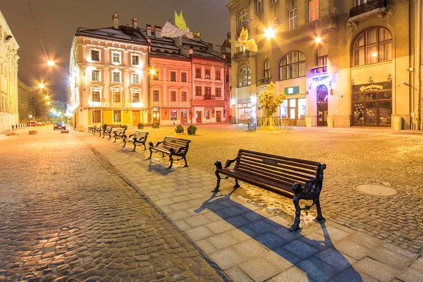 Empty city street lit by lanterns. Lviv. Night. Ukraine