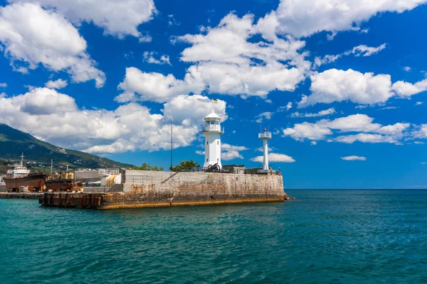View of the lighthouse of Yalta. Summer sunny day with beautiful clouds — Stock Photo, Image