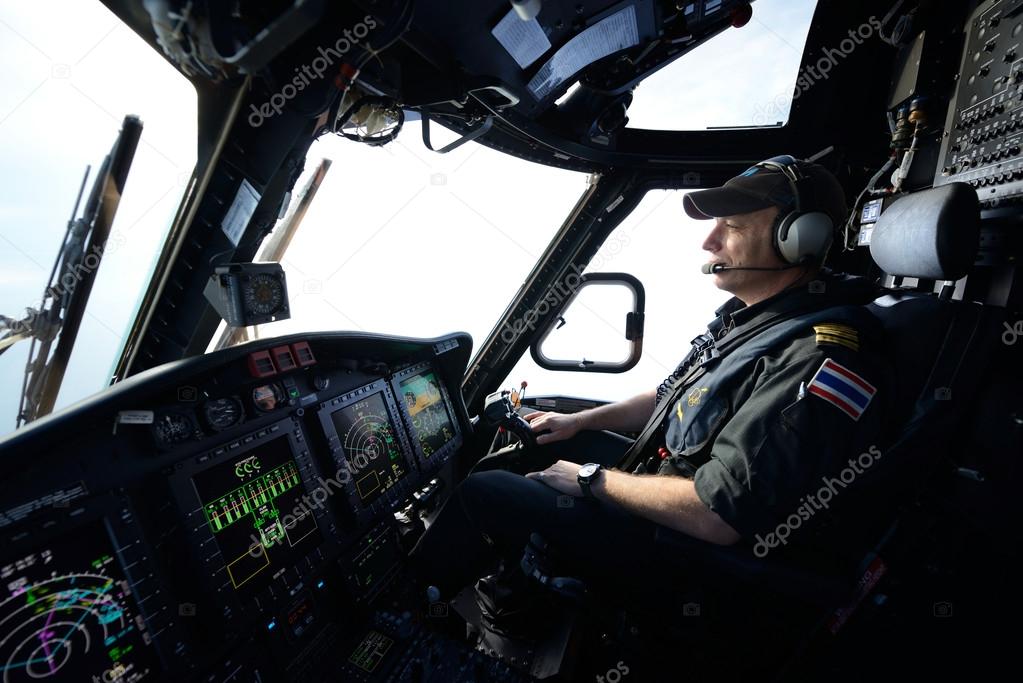helicopter pilot in flight for oil rig operation