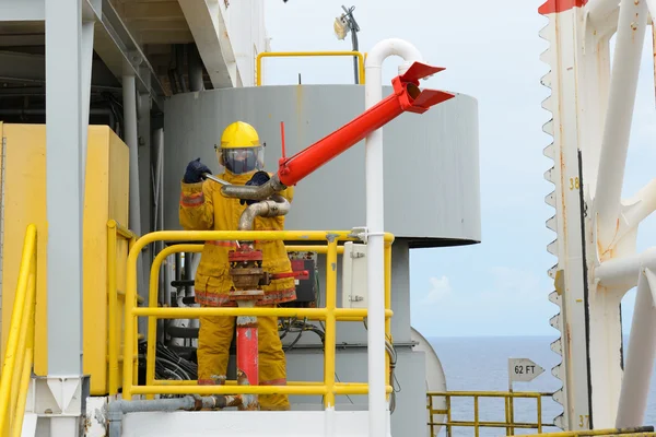 Fireman is guarding for offshore helicopter before start up engi — Stock Photo, Image