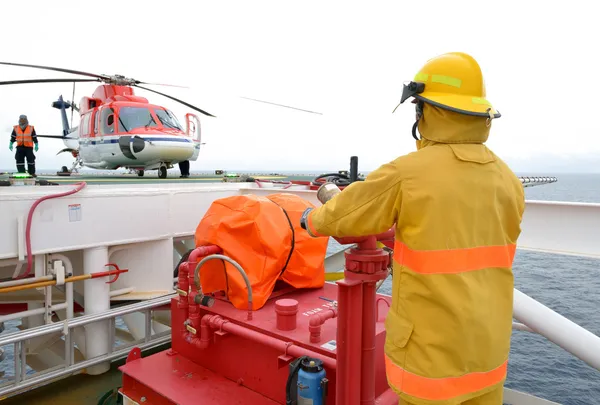 Fireman is guarding for offshore helicopter — Stock Photo, Image