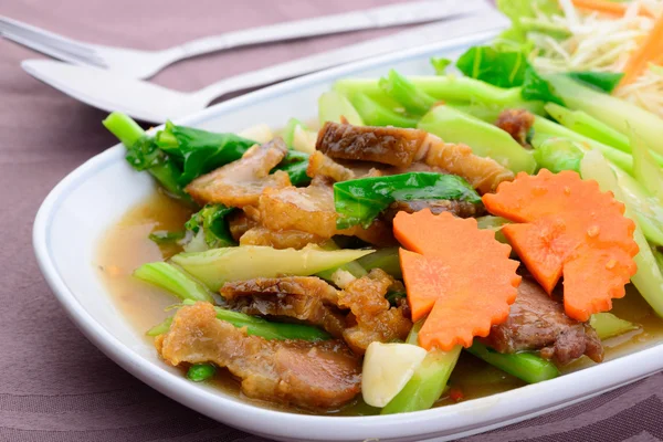 Fried kale with crispy pork — Stock Photo, Image