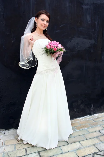 Lovely bride with bouquet — Stock Photo, Image