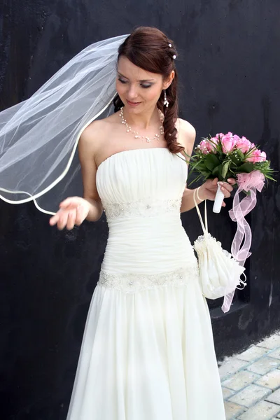 Lovely bride with bouquet — Stock Photo, Image