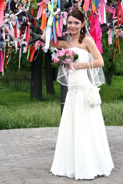 Lovely bride with bouquet — Stock Photo, Image