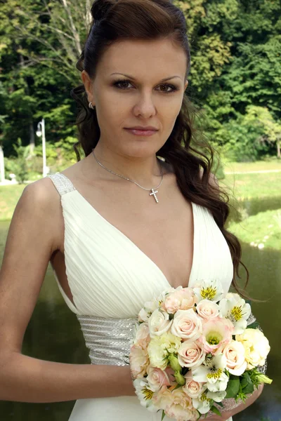 Lovely bride with bouquet — Stock Photo, Image