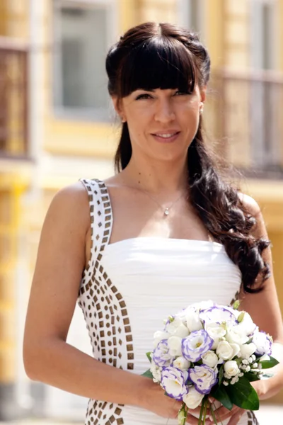 Lovely bride with bouquet — Stock Photo, Image