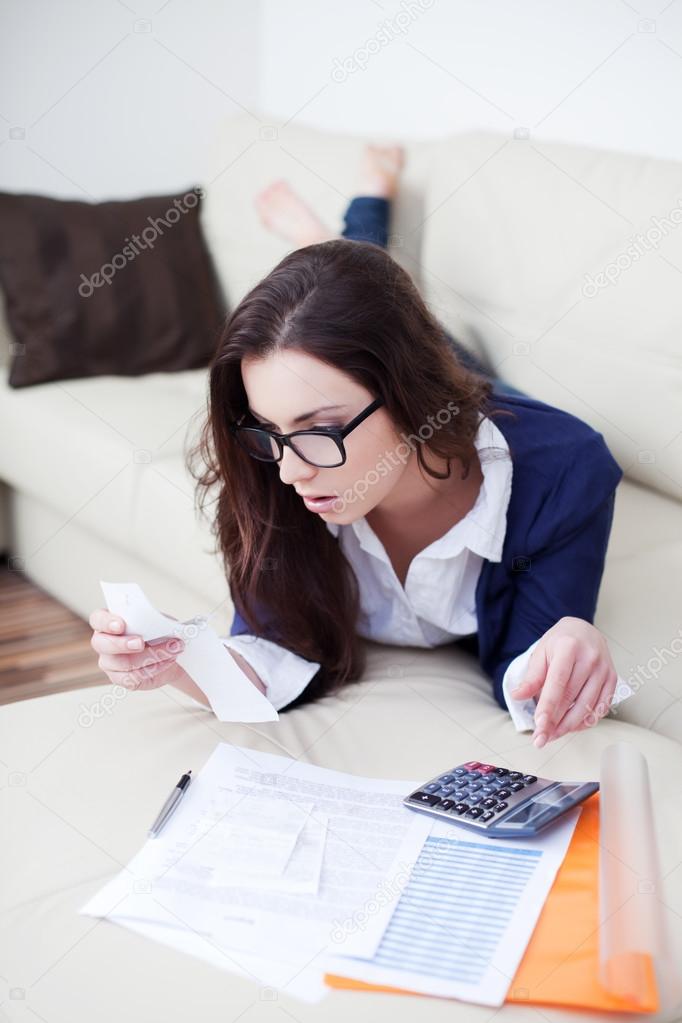 Woman looking at bills