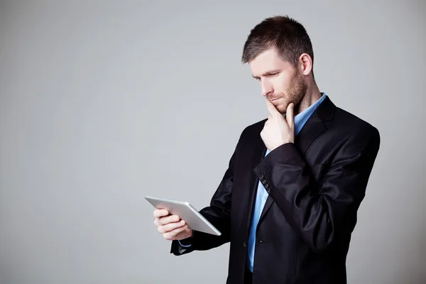 Businessman using digital tablet isolated — Stok fotoğraf