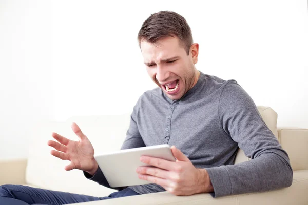 Mad man with digital tablet — Stock Photo, Image