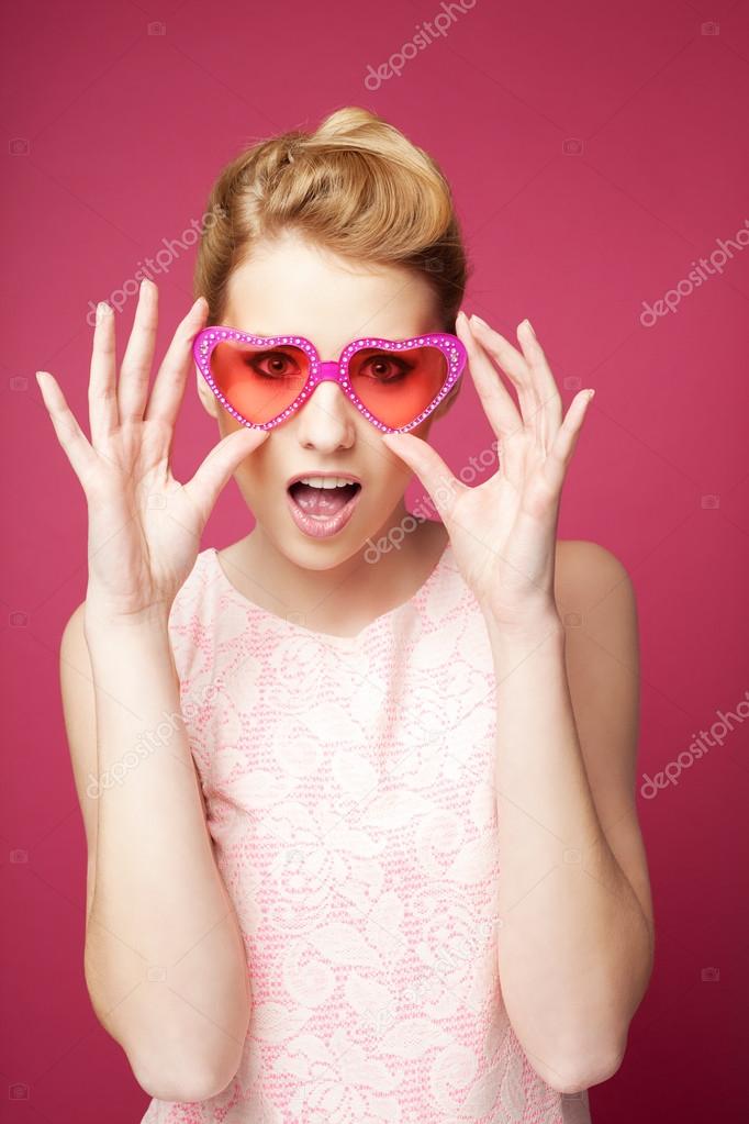 Retro woman with heart sunglasses