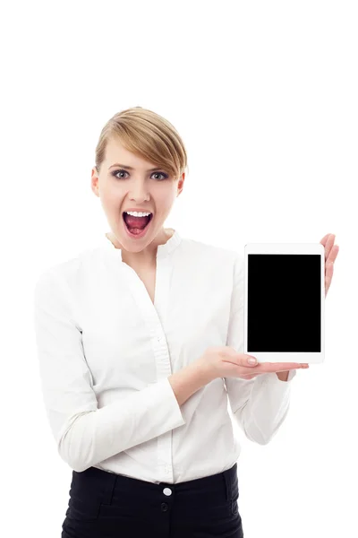 Shoked young woman showing digital tablet — Stock Photo, Image