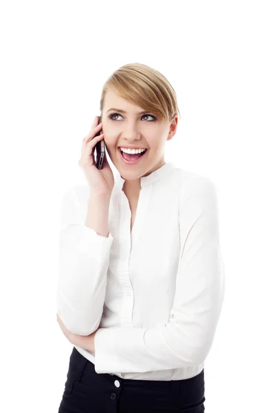 Happy young businesswoman talking on phone — Stock Photo, Image