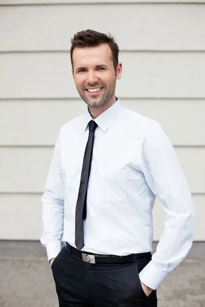 Businessman standing outside the office — Stock Photo, Image