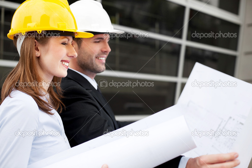 Architects looking at blueprint