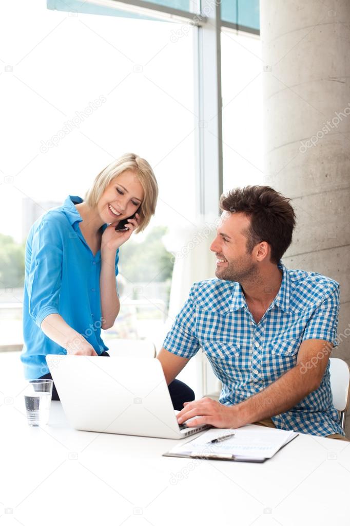 Young couple working together