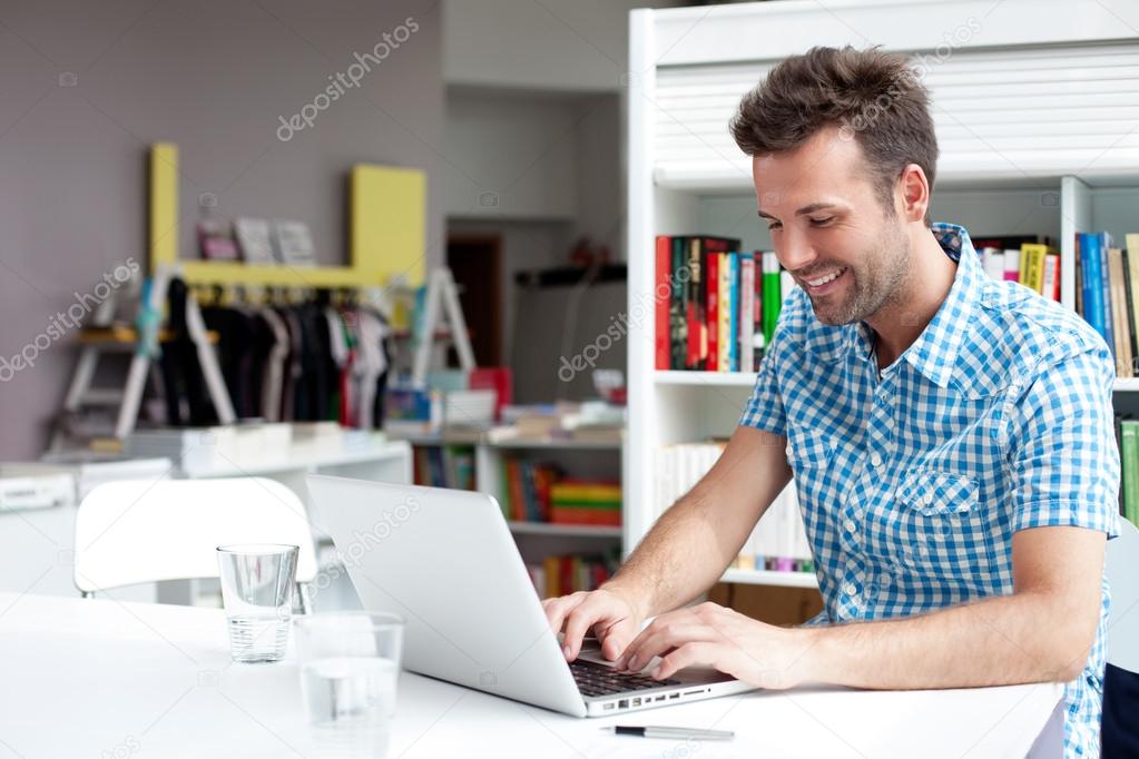 Student working on laptop in library