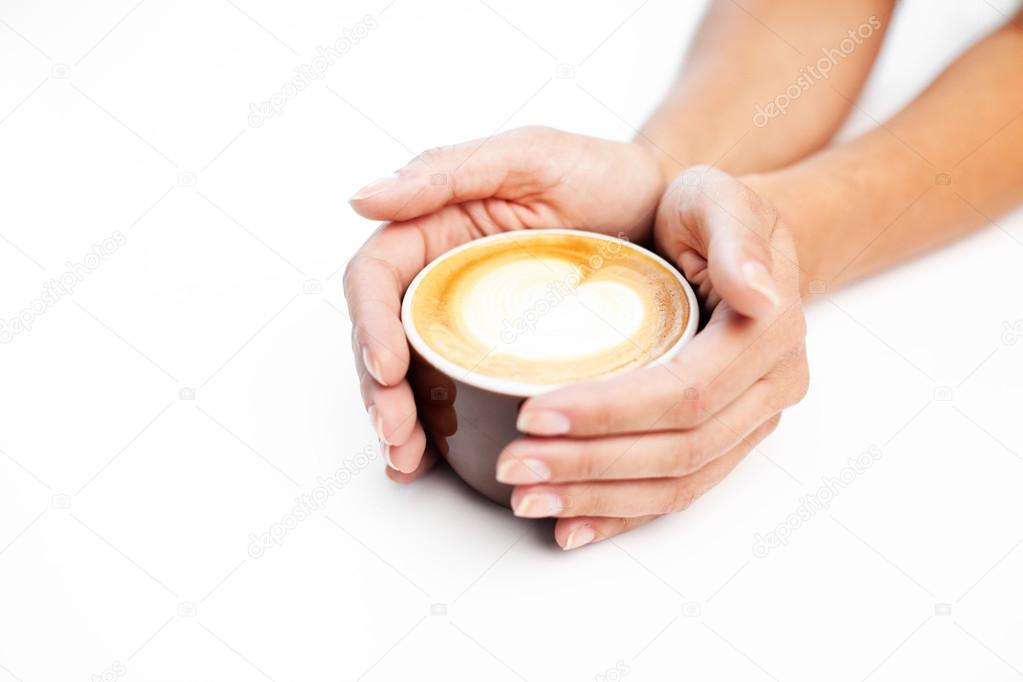 Female hands holding caffee