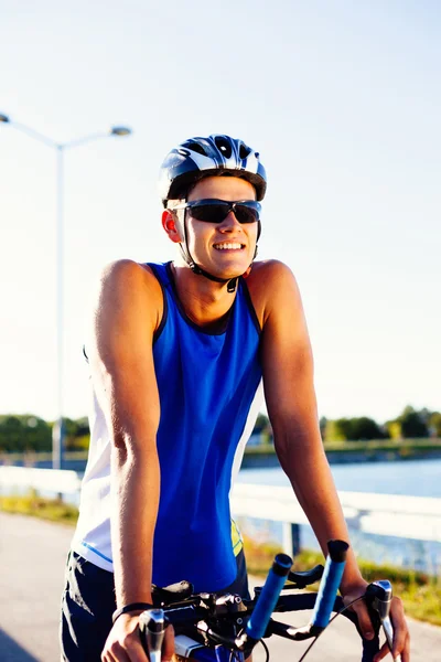 Triathlete with his bicycle — Stock Photo, Image