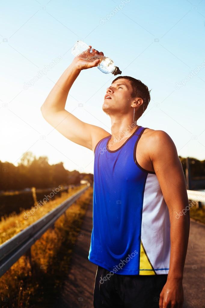 Athlete drinking after workout.