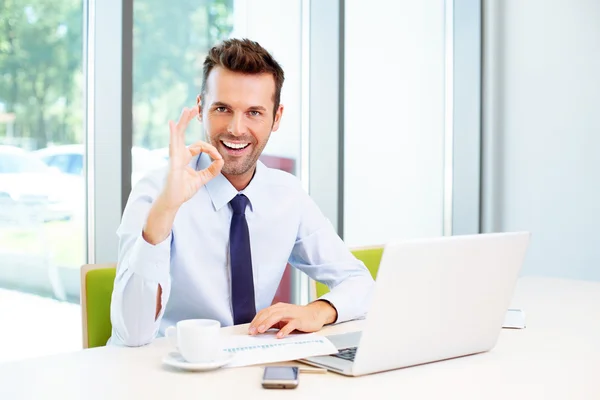 Businessman gestures perfect sign — Stock Photo, Image