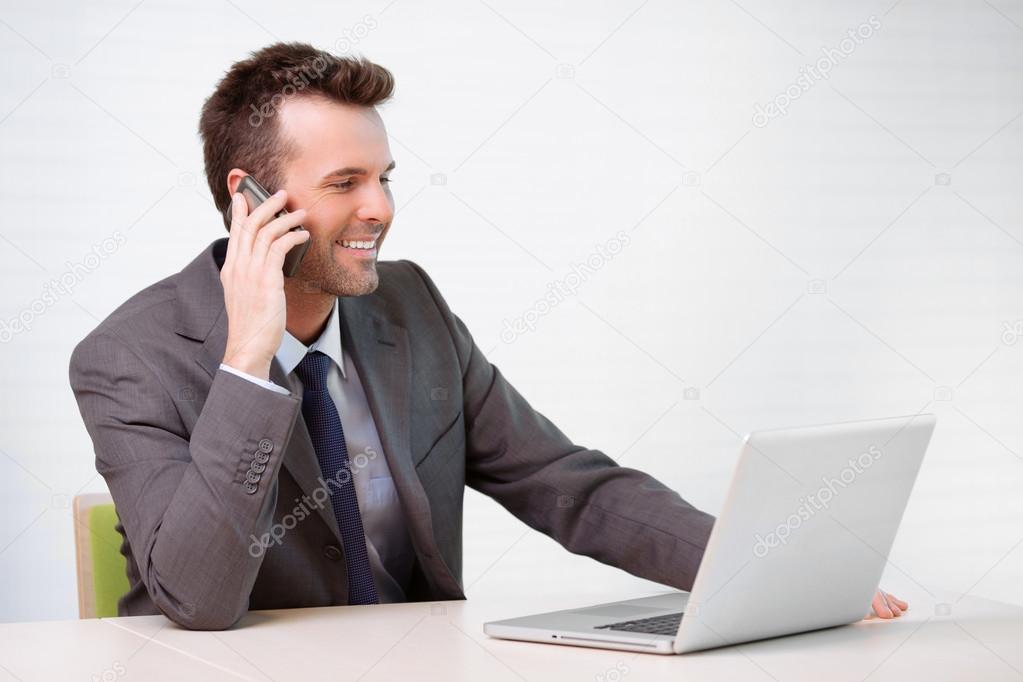 Manager talking on the phone in the office