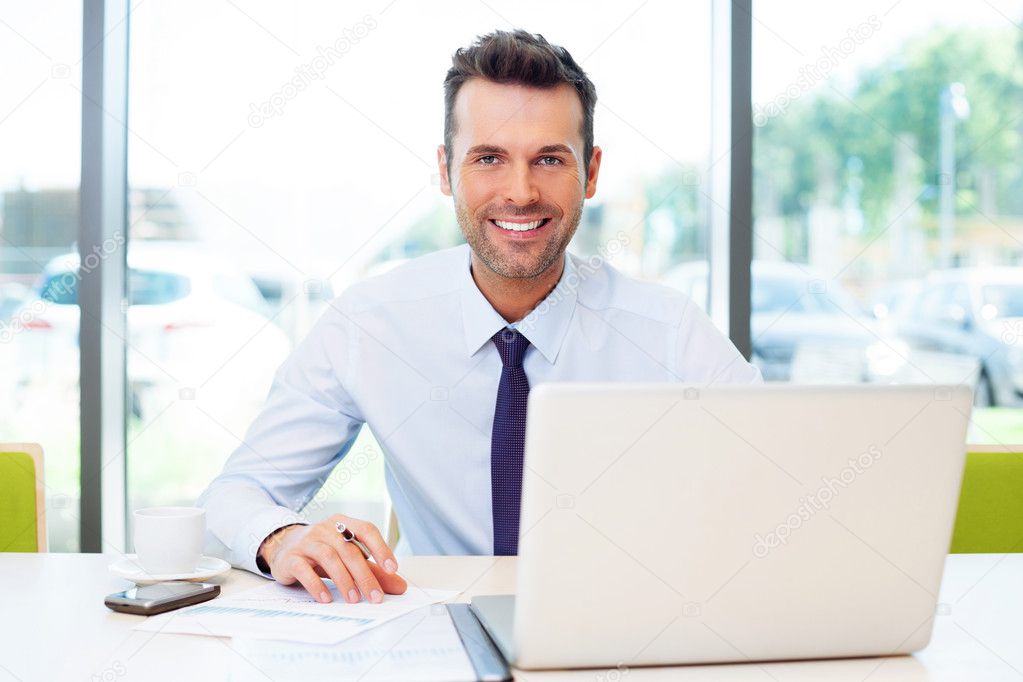 Happy businessman working