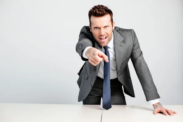 Angry manager pointing at camera — Stock Photo, Image