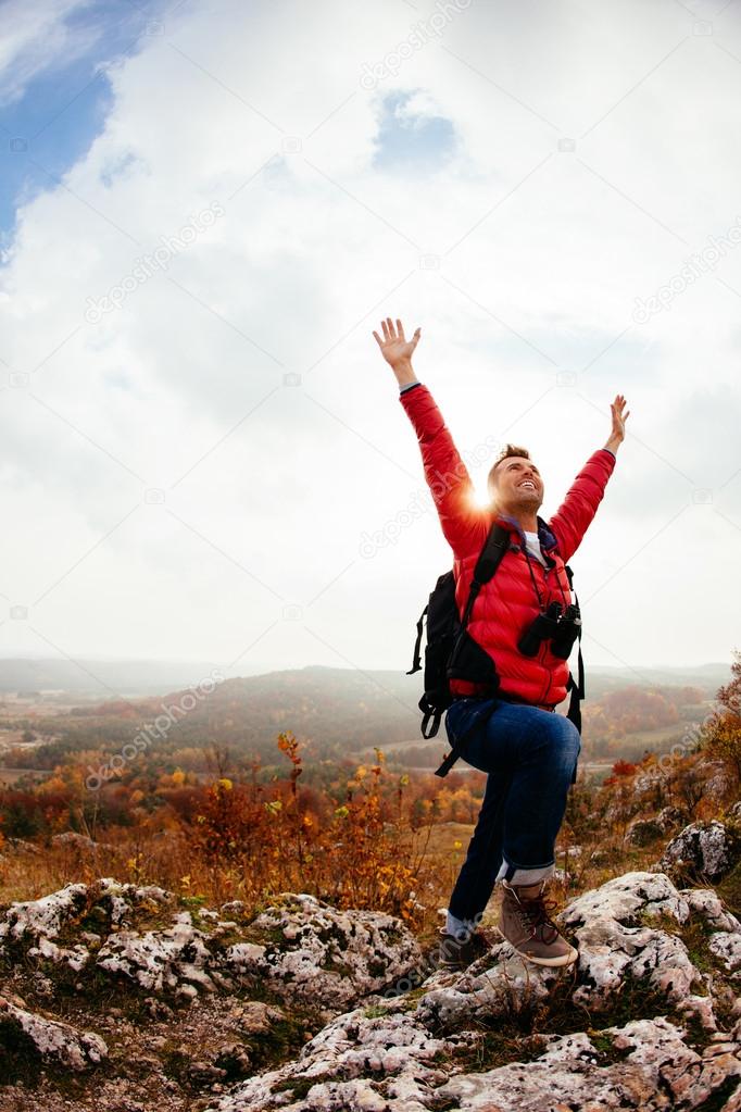 Happy hiker on the peak