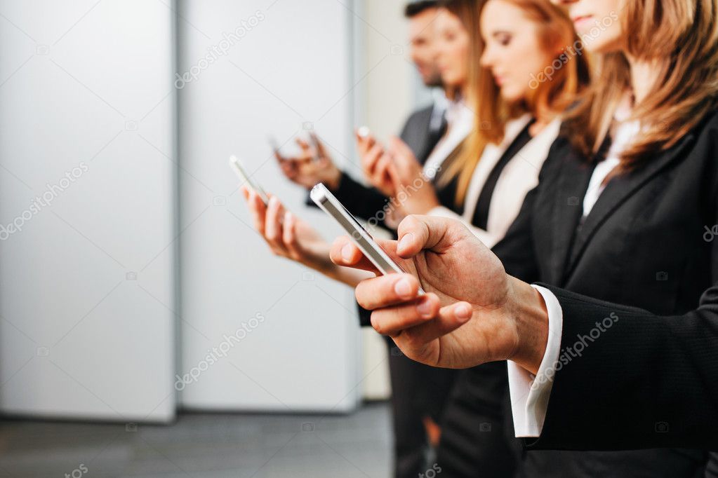 Business people using smartphone