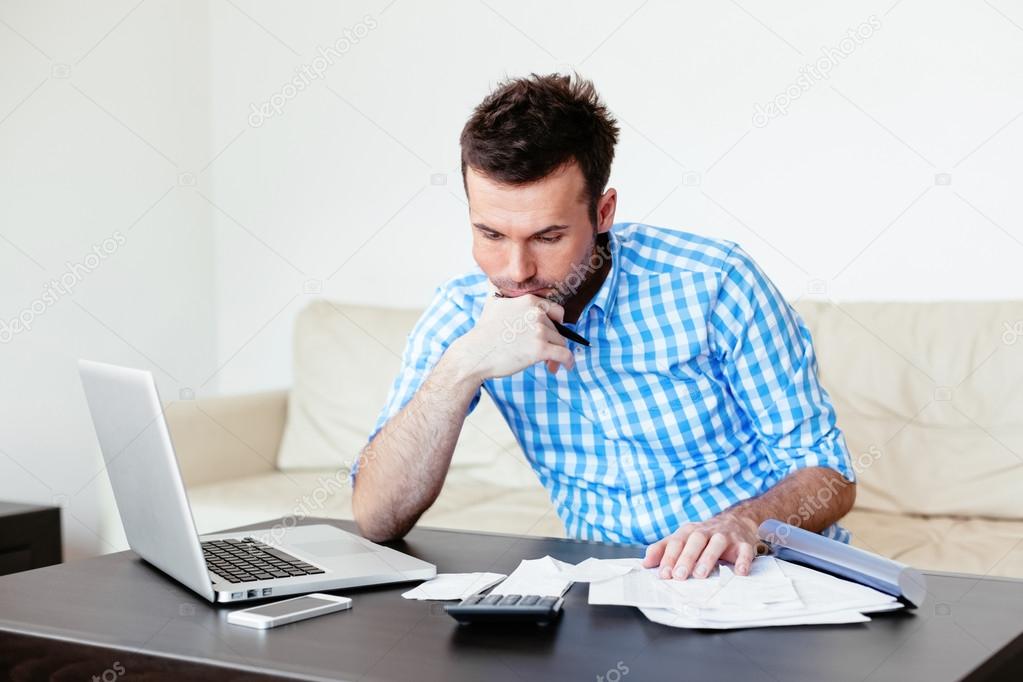 Man checking home finance