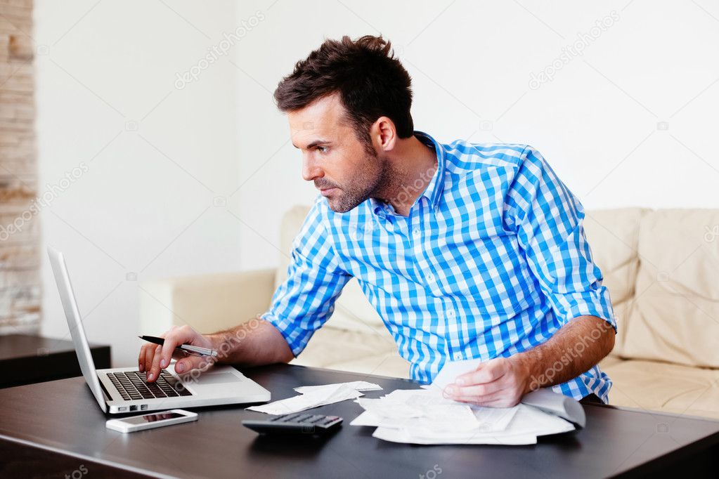 Man checking home finance