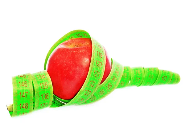 Яблоко с рулеткой — стоковое фото