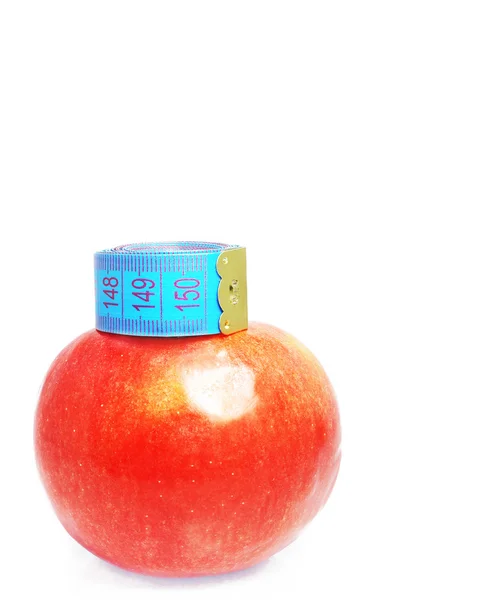 Jabłko z miarą taśmy — Zdjęcie stockowe