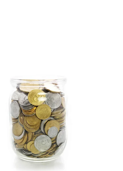 Glass jars holding coins — Stock Photo, Image