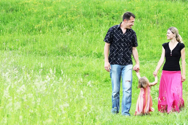 Young family in nature — Stock Photo, Image