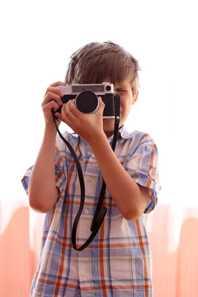 Child with an old camera — Stock Photo, Image