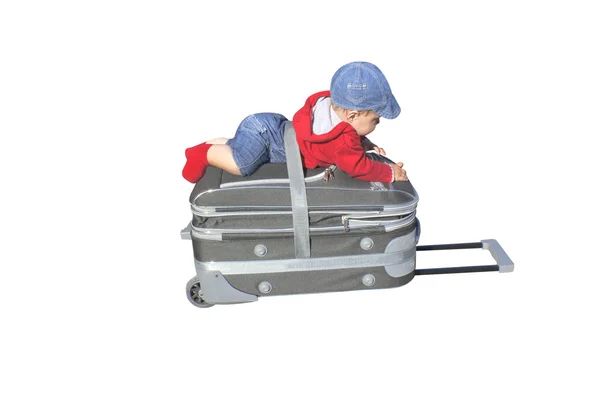 Child lying on the bag Stock Picture