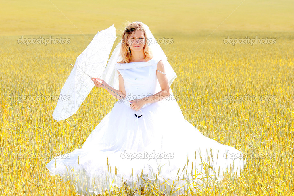Bride on a field of wheat