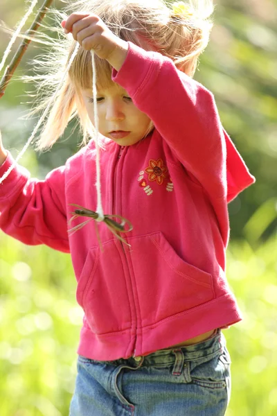 Beautiful little girl in rubber boots at the lake — Stock Photo, Image