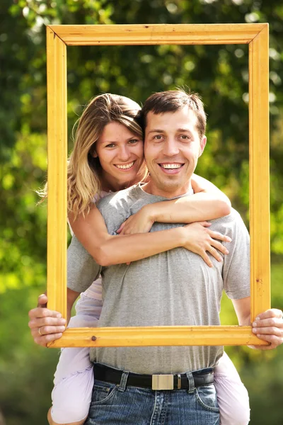 Couple in love in a frame on the nature — Stock Photo, Image